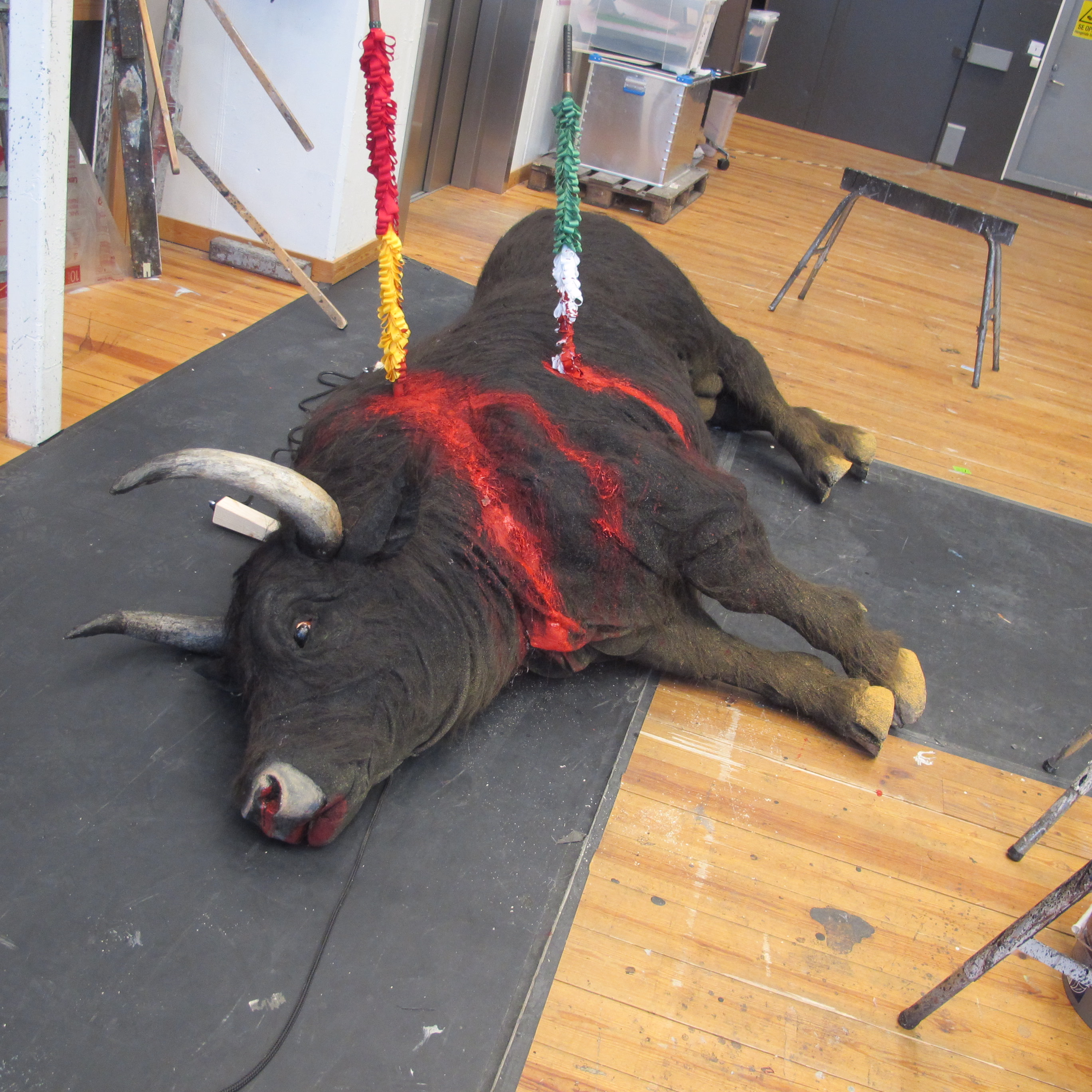 Prop bull lying on the floor.